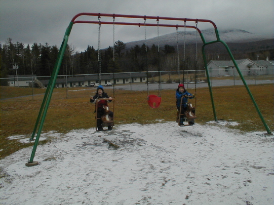 Alex and Luke on the swings